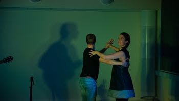 Two performers dancing